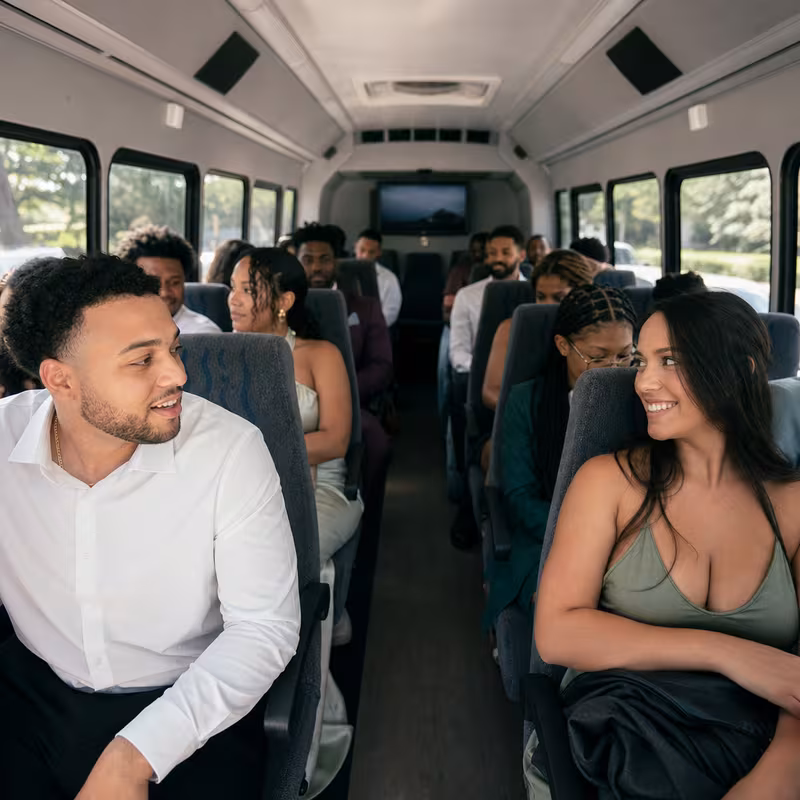 Group boarding a white charter bus for Private Event Transportation transportation in Glendale