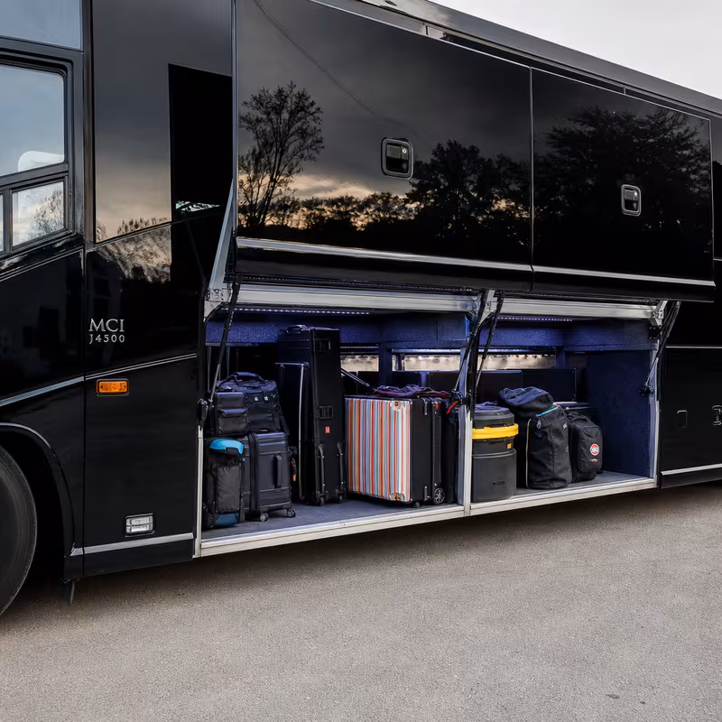 Party bus interior with wraparound leather seating and LED lighting in Glendale