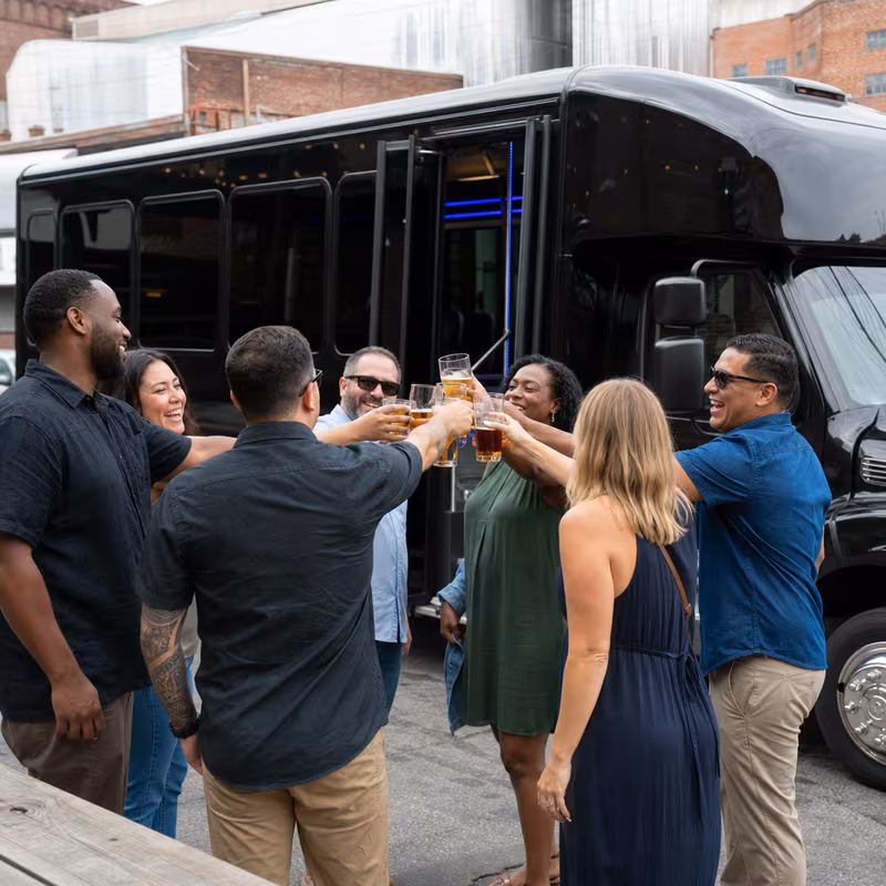 Passengers loading luggage while boarding an Glendale group shuttle